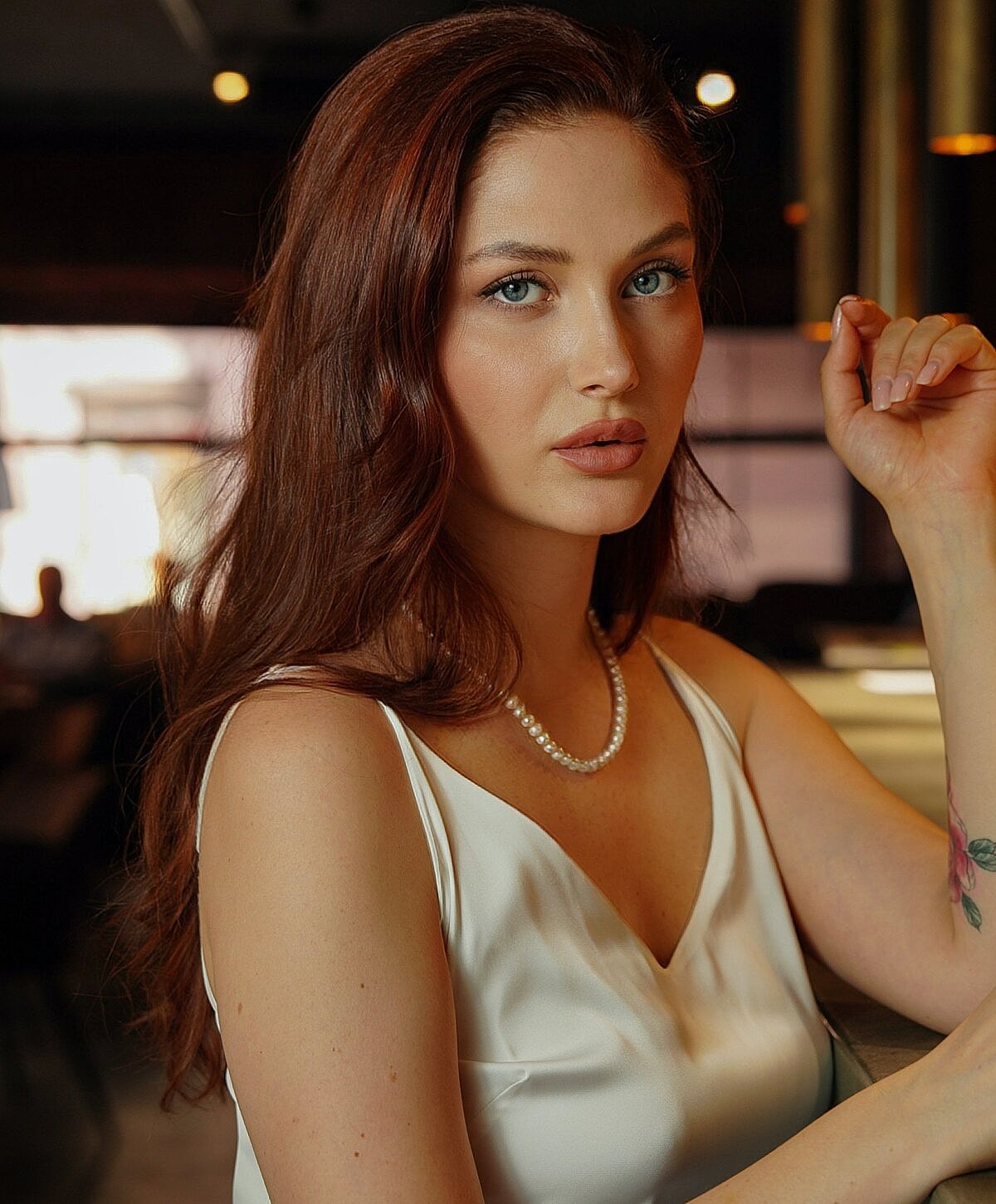 Smiling woman relaxing in a hammock.