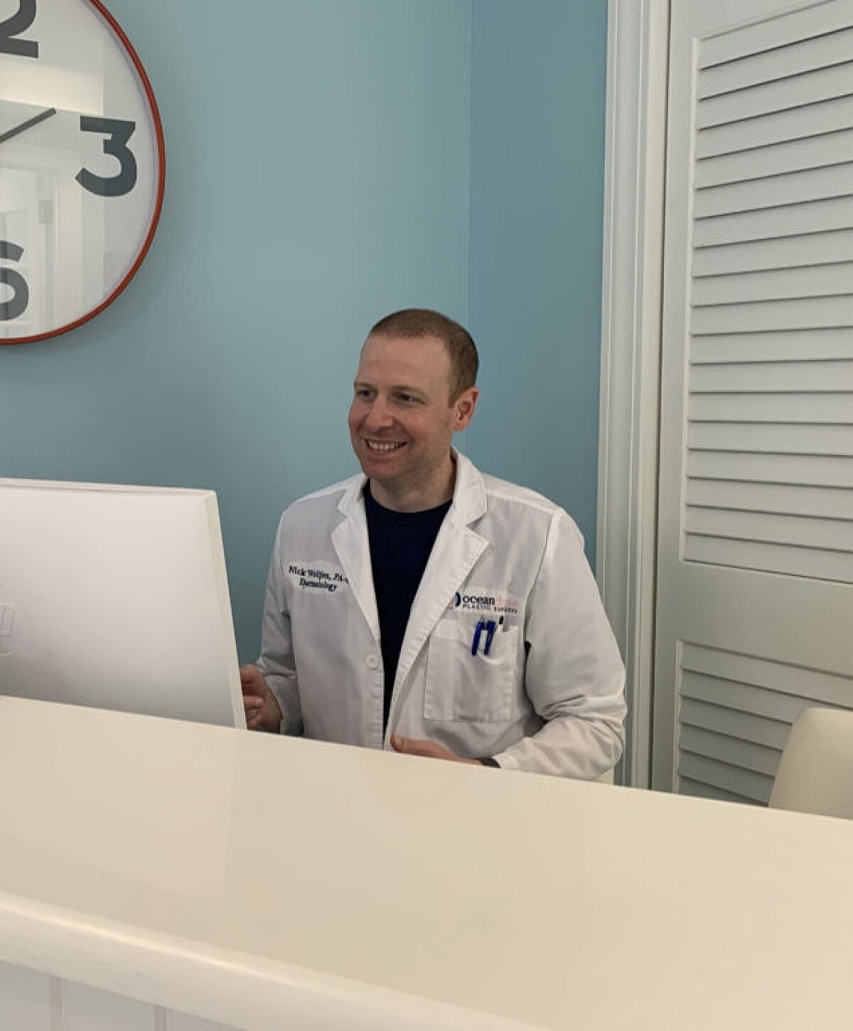 Portrait of a woman with long wavy hair.